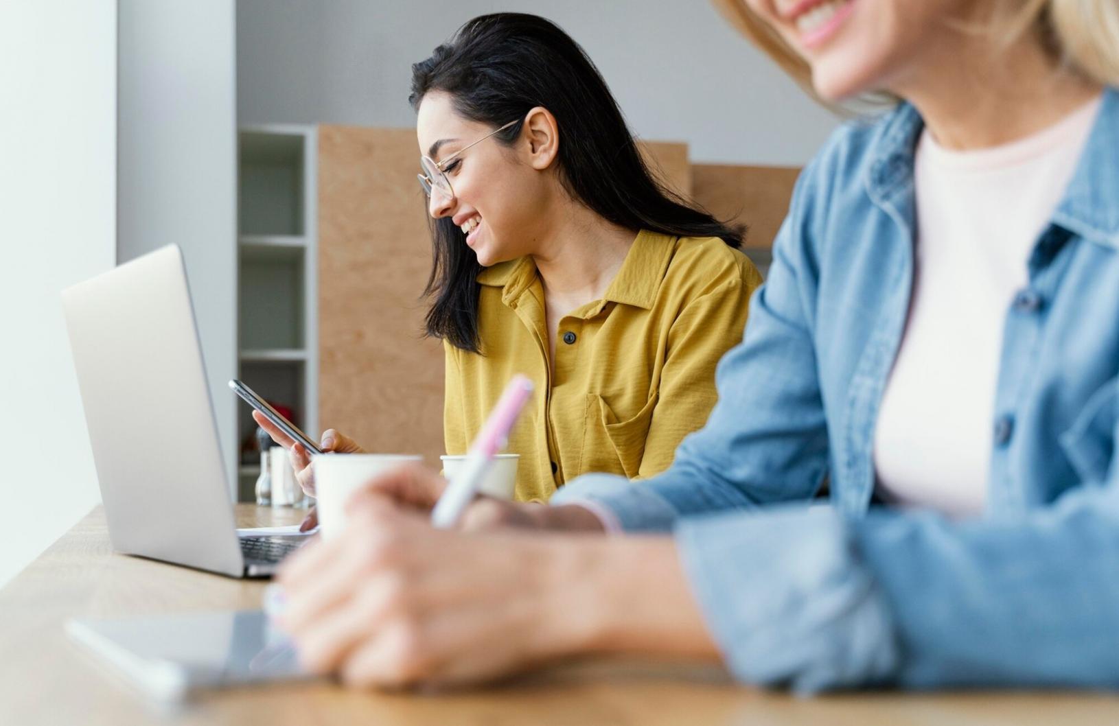 Financial advisor working with small business owner on budget planning and expense tracking