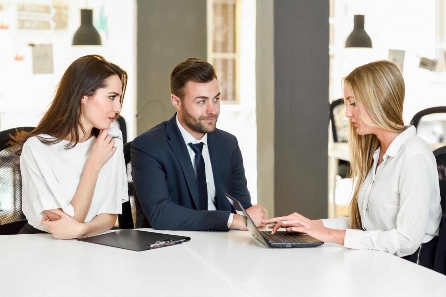 Small business meeting room with financial planning materials and collaborative discussion setup